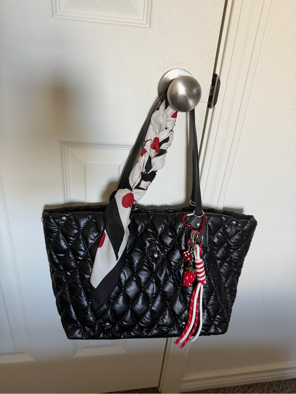 Black Quilted Tote with Red Accent Charm and Scarf Detail